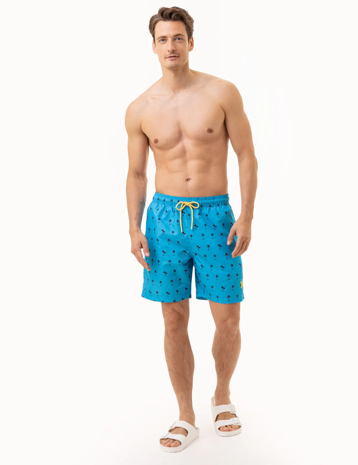 7 PALM TREE PRINT SWIM TRUNKS